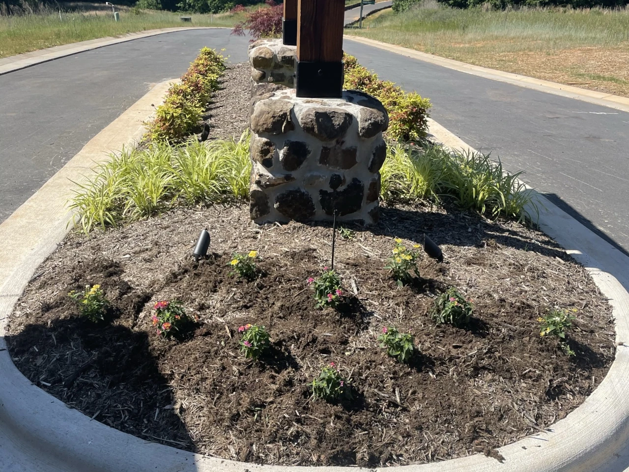 New plant installation at a residential neighborhood entrance in the Piedmont Triad region, NC, by GH Cutting Edge